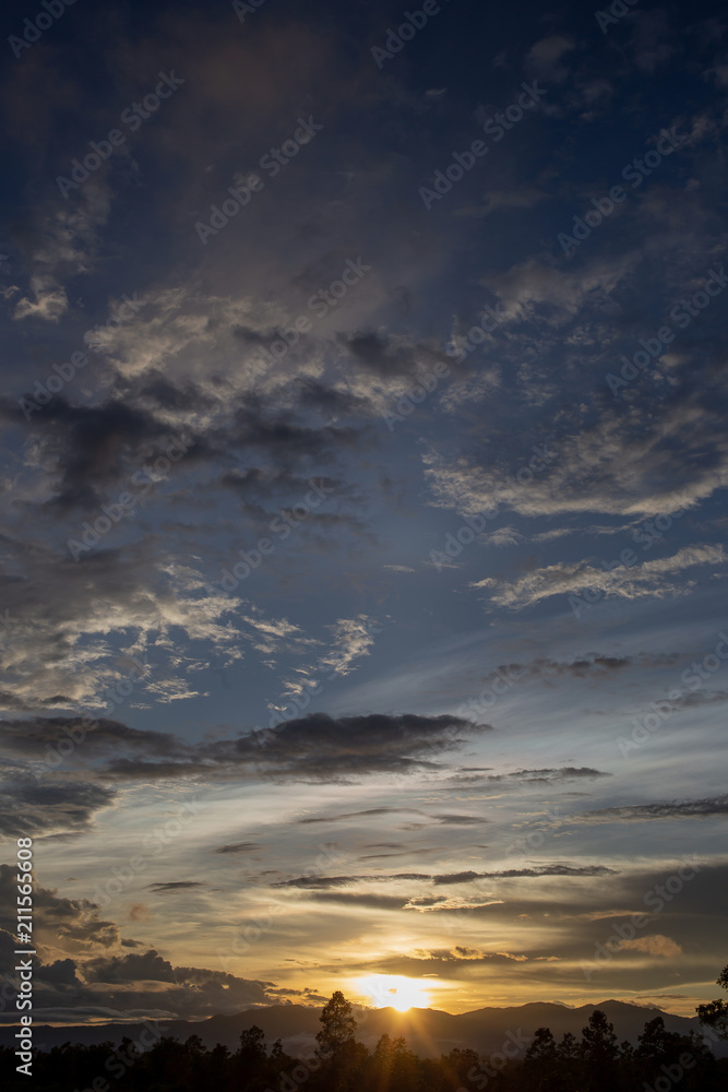 Colorful dramatic sky with cloud at sunset