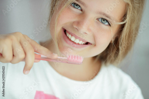 Child cleans teeth   