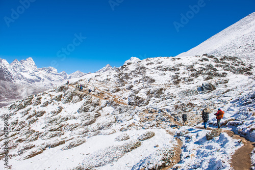 trekker are trekking on the snow mountain to Everest base camp