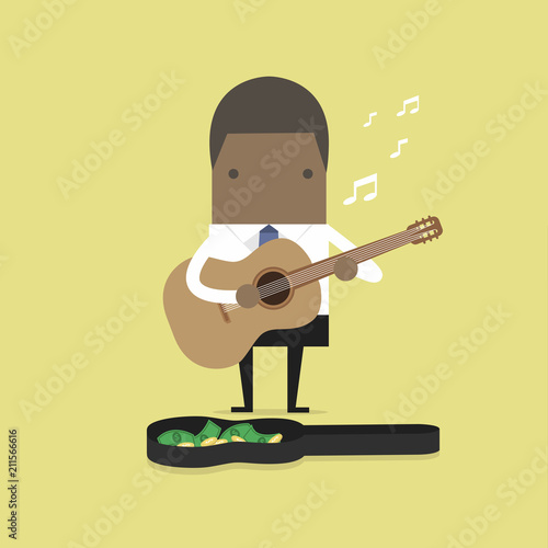 African businessman playing guitar for money.