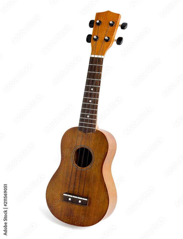 Fototapeta premium The brown ukulele on the white background, with Clipping path