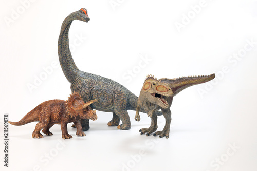 Fototapeta Naklejka Na Ścianę i Meble -  Tyrannosaurus Triceratops Brachiosaurus Dinosaur Toy figurine on white background