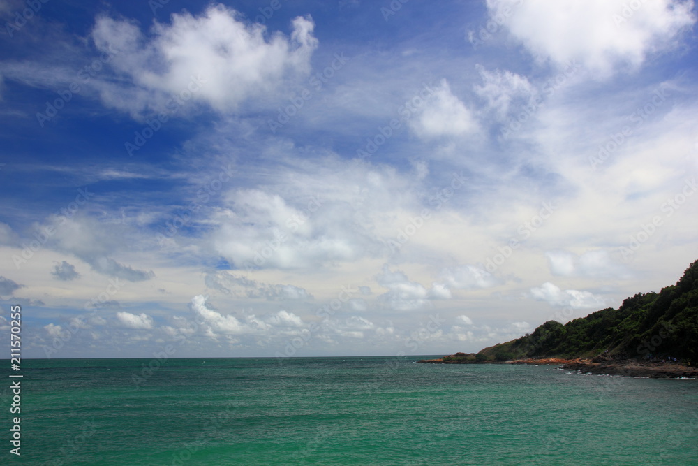 Tropical and calm sea with islands on the horizon and white clouds,Blue sky for background.