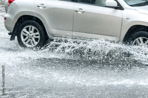 car traffic during rainy day. splashes of water from car wheels © Mr Twister