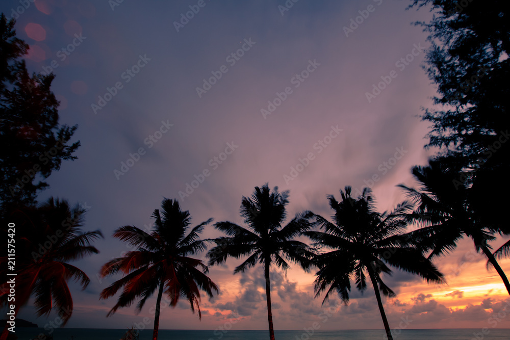 Obraz premium View of the sunset at Mai Khao Beach in Phuket, Thailand