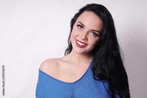 happy smiling attractive young woman wearing off-the-shoulder top. with copy space.