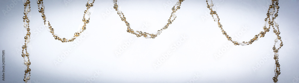 Christmas background with Golden tinsel and garland Christmas background with Golden tinsel and garland