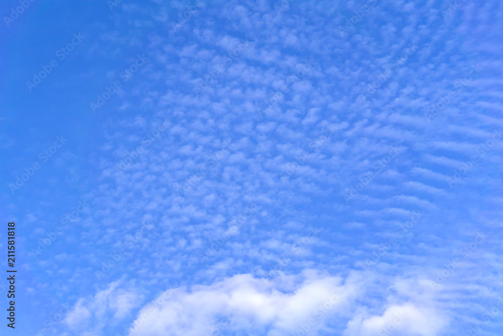 blye sky with white fluffy clouds background
