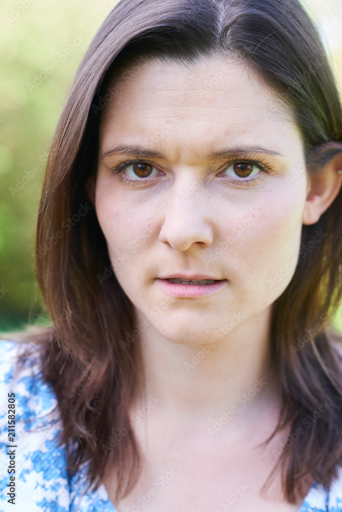 Outdoor Head And Shoulder Portrait Of Worried Young Woman Outdoor Head And Shoulder Portrait Of Worried Young Woman