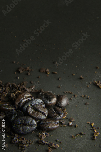 The coffee roasted on black texture close up background..
