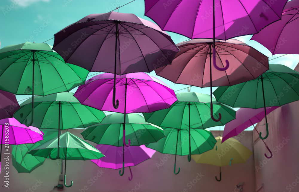 wonderful colorful umbrellas like the rainbow take flight to the sky