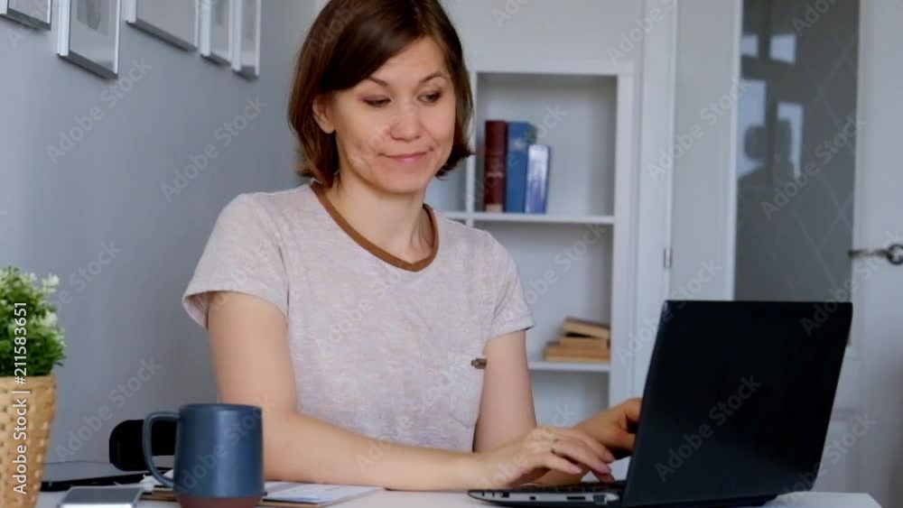 Woman working at home office, feeling sleepy, yawning Woman working at home office, feeling sleepy, yawning