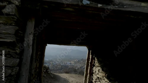 Entrance gate to nepalese village Sama Gaon among the mountains. photo