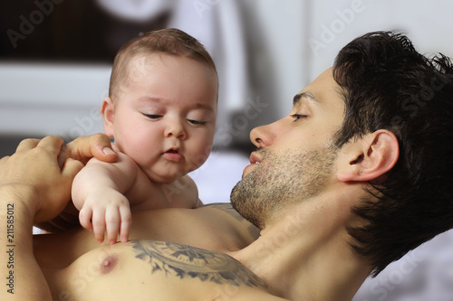 Handsome father shirtless with daughter .Love moment 
