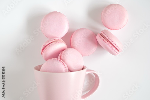 Pink macaroons on white background. Sweet background. Flat lay, top view, copy space 