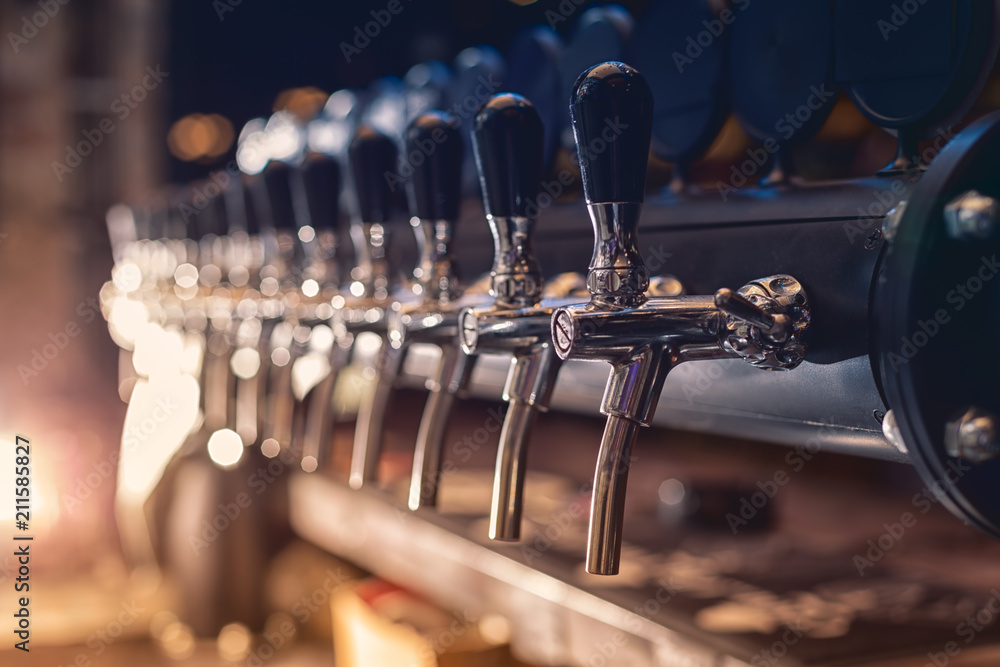 Beer tap in the row - obrazy, fototapety, plakaty 