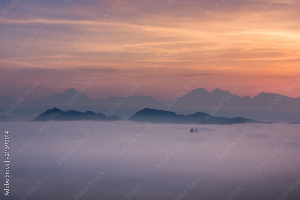 Foggy morning in Alps near Skofja Loka, Slovenia