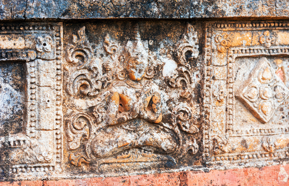 View of the bas-relief on the ancient pagoda in Bagan, Myanmar. Close-up.
