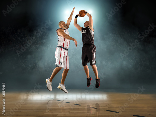 Caucasian Basketball Player in dynamic action with ball 