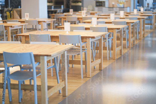 Interior of wooden table in food court shopping mall. Food center in department store.