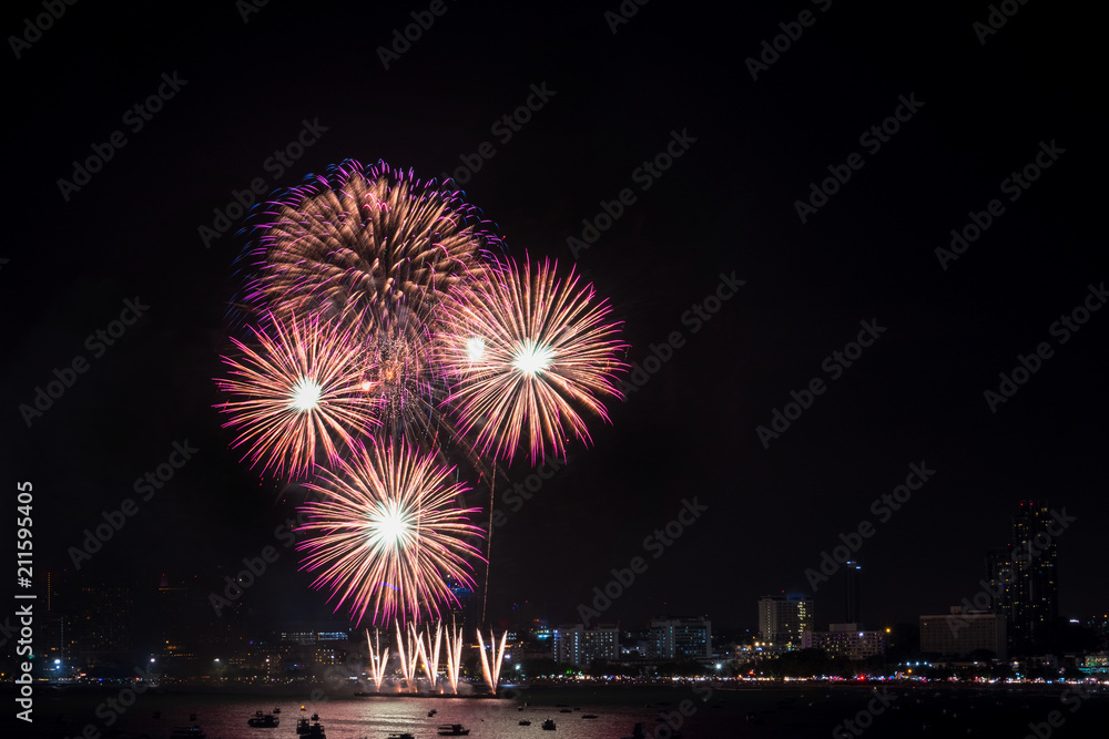 Fireworks explored over cityscape at night in Pattaya International Fireworks Festival .Holiday and celebration background.