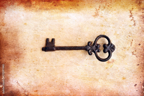 old paper on brown wood texture and key for background  © nimon_t