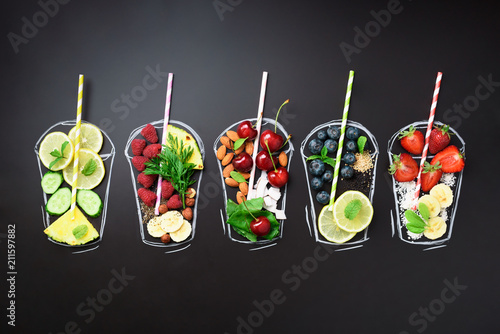 Fotografie Food ingredients for blending smoothie or juice on painted glass over black chalkboard