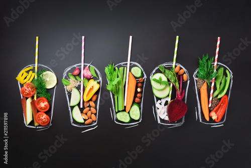 Fotografie Food ingredients for blending smoothie or juice on painted glass over black chalkboard