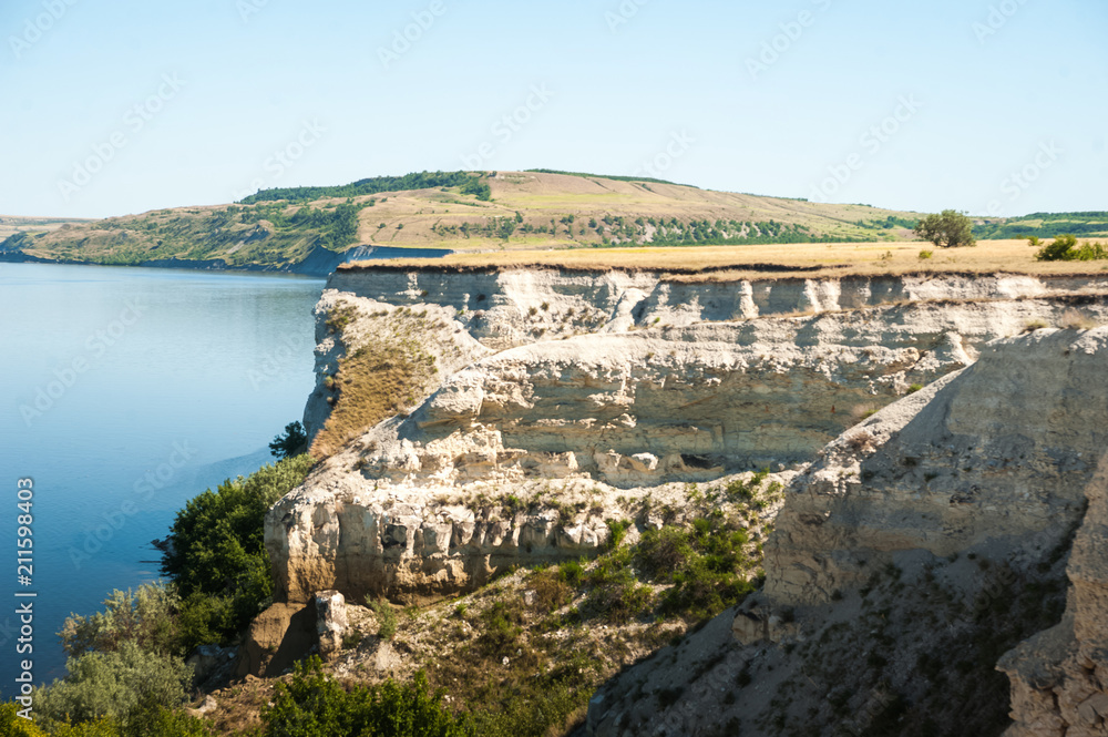 A beautiful photo of the nature of rocks and water. Cliff, ridge, canyon. Refuge, rest, relaxation, tourism. Cliff Stepan Razin, Russia, Saratov A beautiful photo of the nature of rocks and water. Cliff, ridge, canyon. Refuge, rest, relaxation, tourism. Cliff Stepan Razin, Russia, Saratov