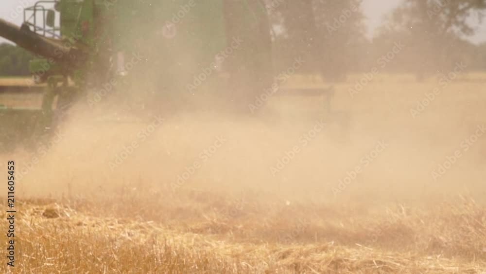 Combine harvester for harvesting wheat. Slow motion Combine harvester for harvesting wheat. Slow motion