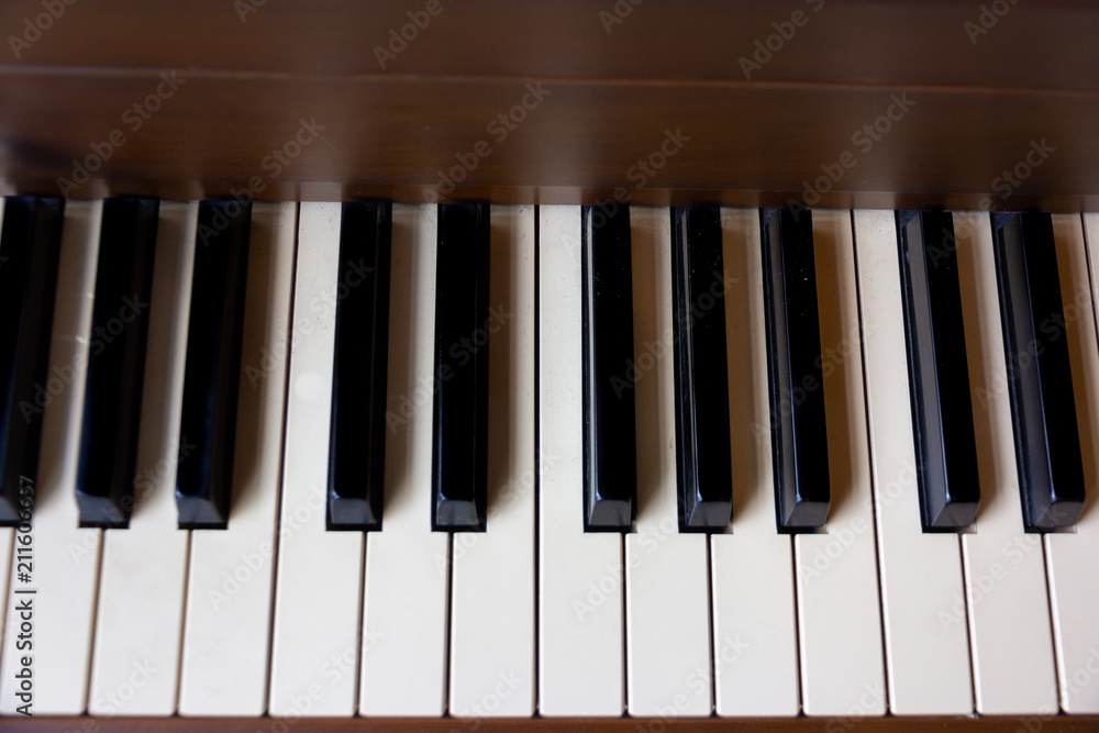 Close up of antique piano keys and old grain wood Close up of antique piano keys and old grain wood