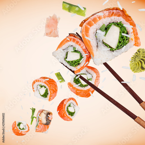 Pieces of delicious japanese sushi frozen in the air.