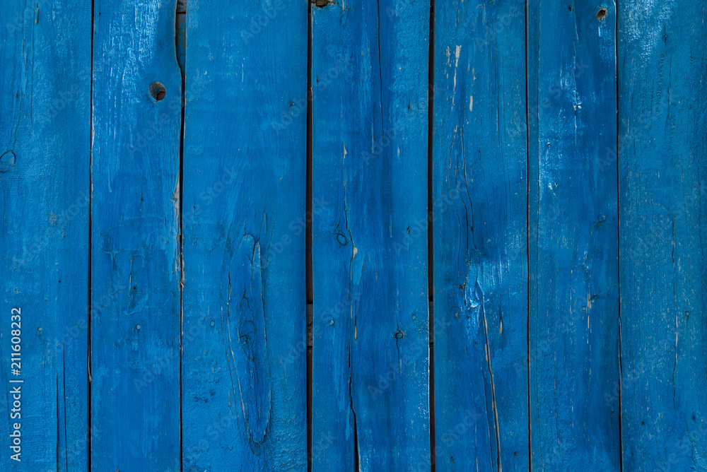 Grunge wooden background - old boards painted in blue color Grunge wooden background - old boards painted in blue color