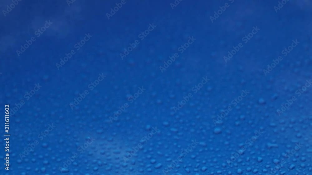 Rain drops on a blue smooth surface. Rain drops on a blue smooth surface.