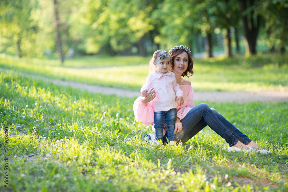 Fototapeta premium Mom and daughter are two years