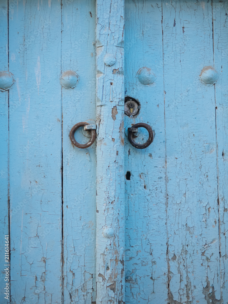 Aged wooden door in metal rivets Aged wooden door in metal rivets