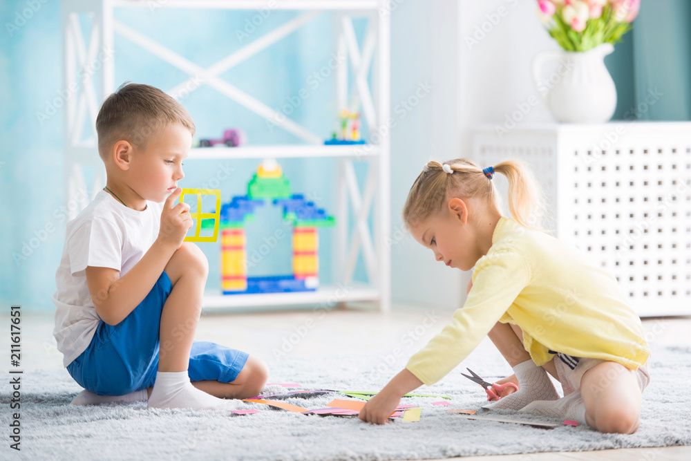 boy with a girl playing at home boy with a girl playing at home
