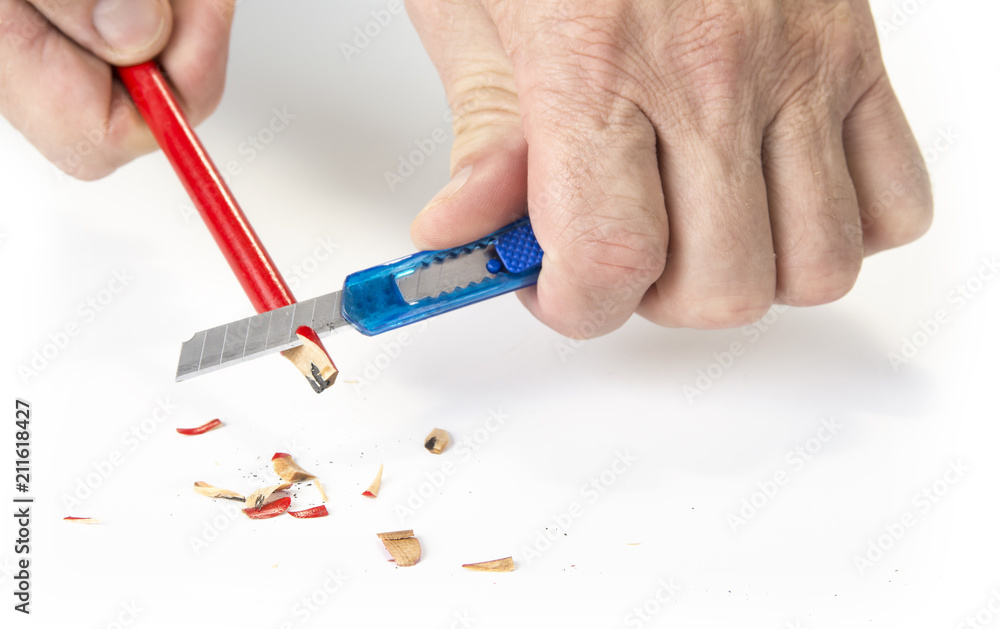 Carpenter pencil sharpen with cutter knife on white Carpenter pencil sharpen with cutter knife on white