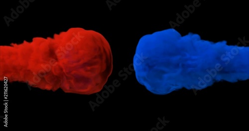 Close up of the colourful drops of red and blue colliding in a slow motion on the black background like smoke explosion and mixing. With alpha matte channel.