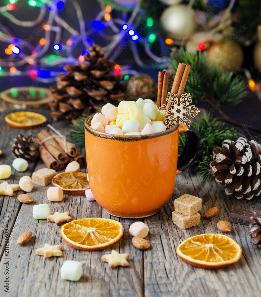 a cup of Christmas hot cocoa with marshmallow New Year's lights and decorations, selective focus a cup of Christmas hot cocoa with marshmallow New Year's lights and decorations, selective focus