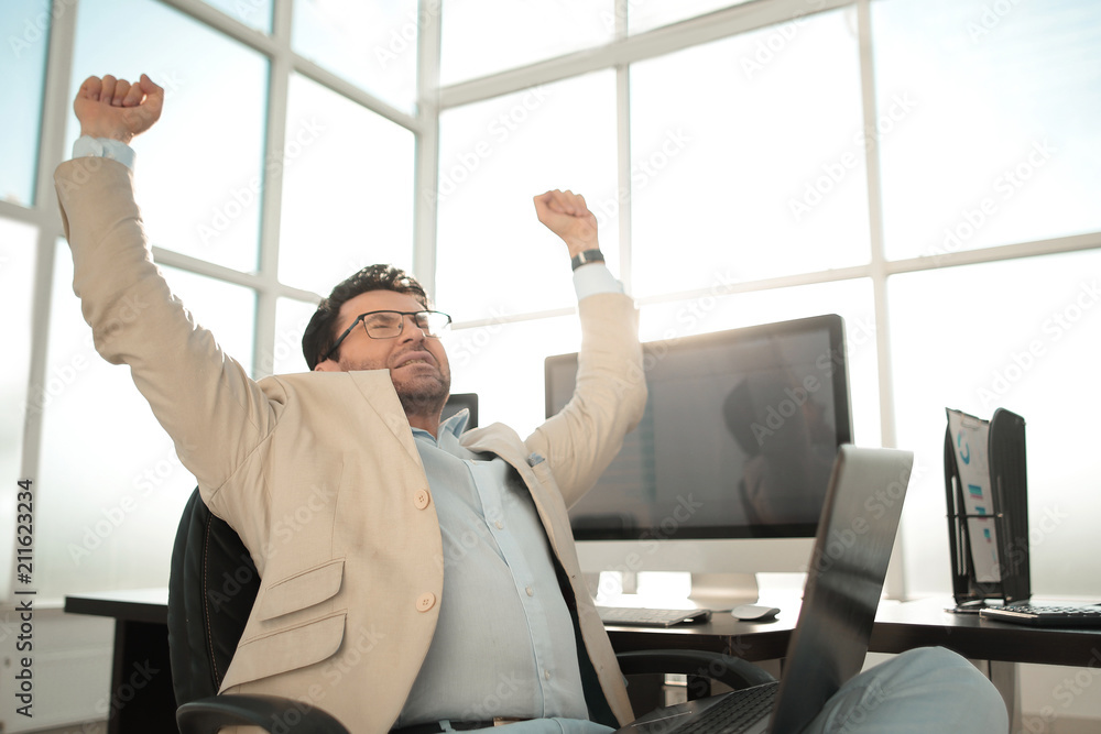 tired businessman sitting in front of the Desk tired businessman sitting in front of the Desk