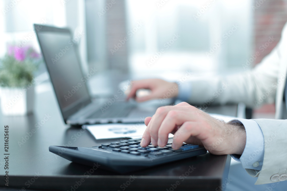 close up.The businessman analyzes the financial indicators. close up.The businessman analyzes the financial indicators.