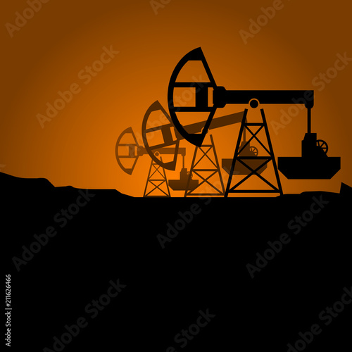 Silhouettes of petroleum pumpjack on sunset - oil pumps