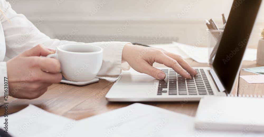 Side view of business woman working on laptop Side view of business woman working on laptop