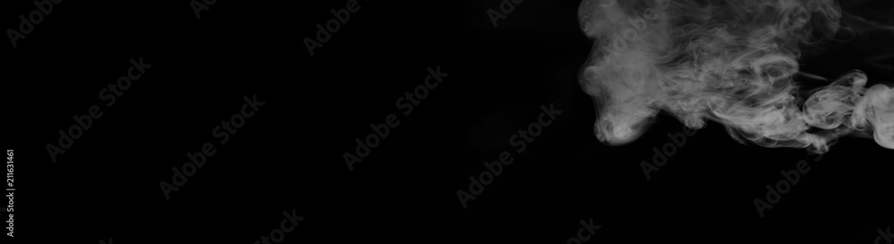 White smoke on a black background. Texture of smoke. Clubs of wh White smoke on a black background. Texture of smoke. Clubs of wh