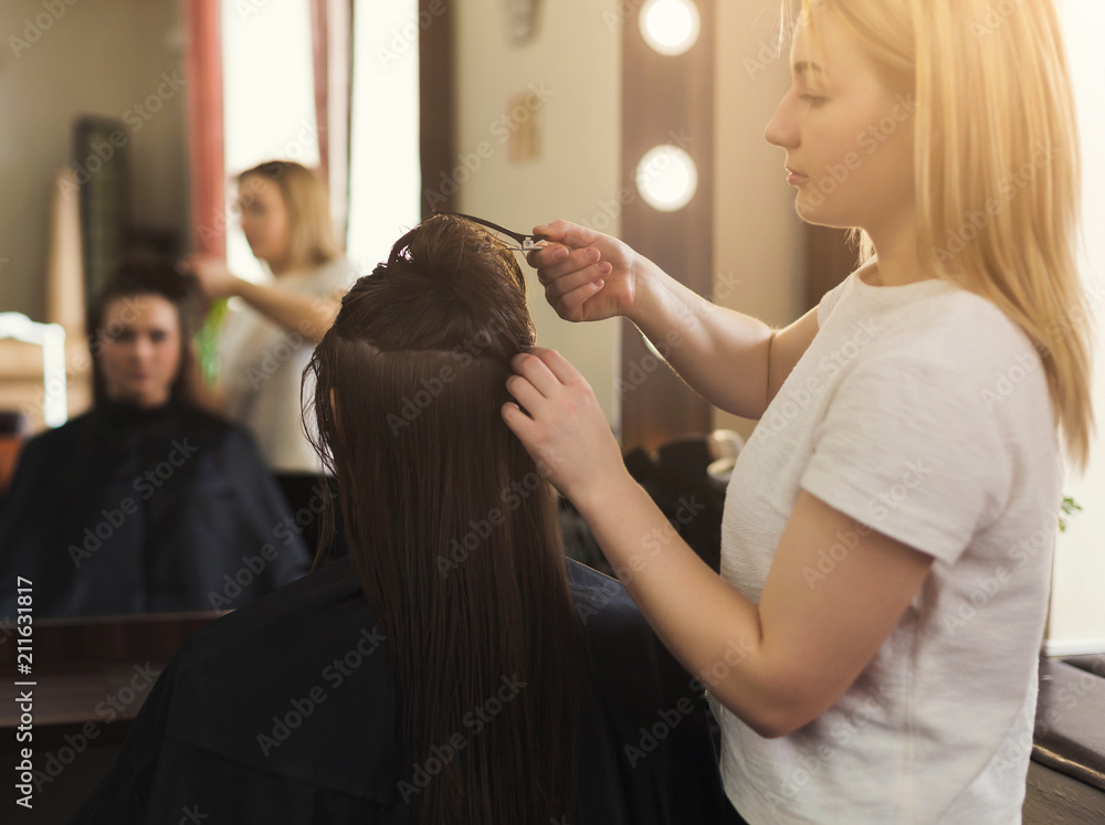 Woman getting hairdo at salon