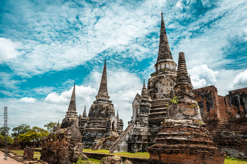 Fototapeta premium Historic ruins of ancient capital city of Thailand with temples during bright sunny day, Ayutthaya, Thailand