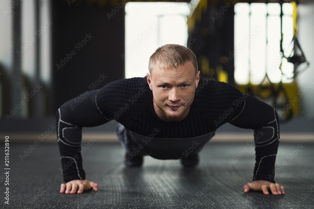 Young man fitness workout, push ups or plank Young man fitness workout, push ups or plank