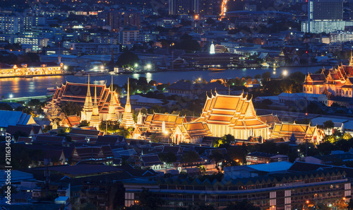 Wat Pho or Wat Phra Chetuphon Vimolmangklararm Rajwaramahaviharn at night in Bangkok City, Thailand. Buddhist temple. photo