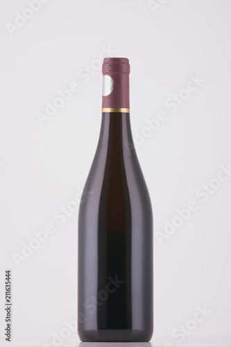 Wine bottle of dark color on white background